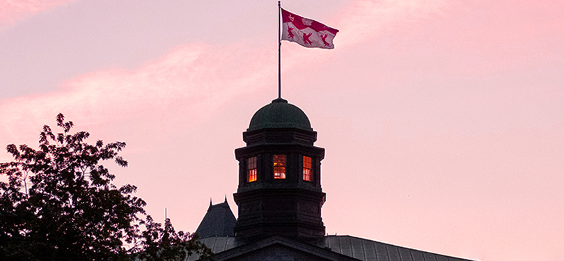 The arts building cupola with McGill flag raised